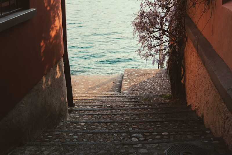 an open door leading to a body of water