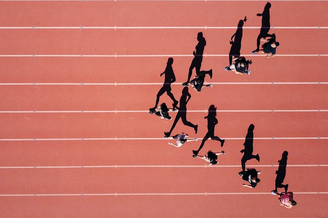 group of people running on stadium