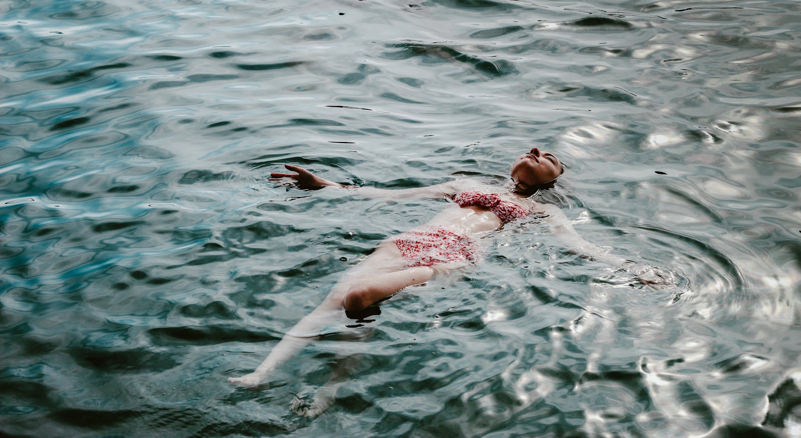 A Woman Swimming in a Lake